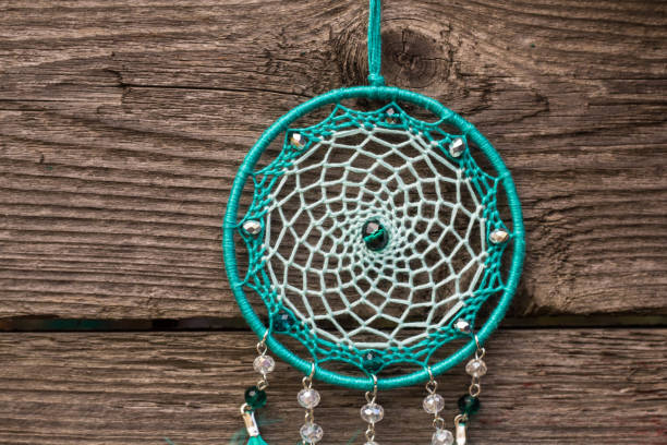 istock Handmade dream catcher with feathers threads and beads rope hanging 1267149410