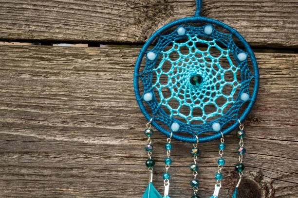 istock Handmade dream catcher with feathers threads and beads rope hanging 1267149411