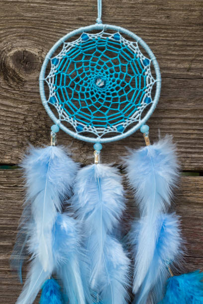 istock Handmade dream catcher with feathers threads and beads rope hanging 1267149416