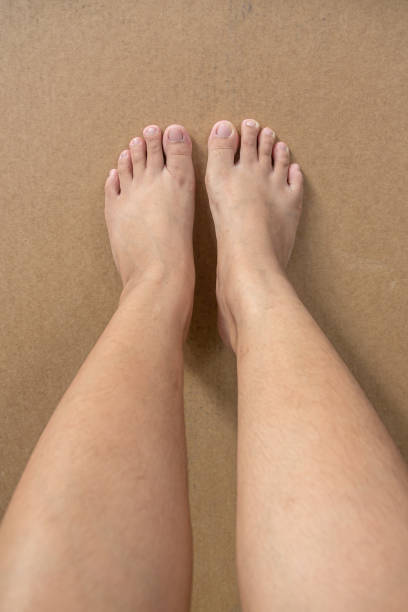 istock women foot on brown background 1267149557