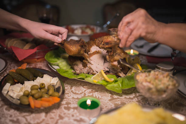 istock Cutting meat during thanksgiving dinner at home 1267149754