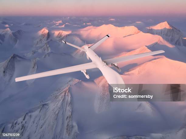 Military Rc Military Drone Flies Against The Background Of Beautiful Arctic Ice Mountains Painted Pink By The Sunset Sun Elements Of This Image Furnished By Nasa Stock Photo - Download Image Now