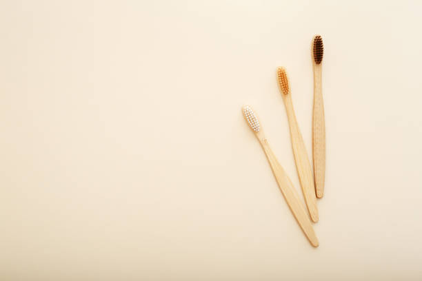 istock Eco-friendly bamboo tooth brush. Zero waste set on light beige natural background. Flat lay style. 1267152391