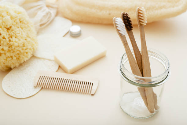 istock Zero waste and plastic free concept with bamboo tooth brush, towel, sea sponge, loofah, soap, wooden hair brush. Eco-friendly bathroom. Natural products. 1267152425