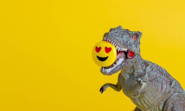 istock Dinosaur on a yellow background. Toy. Creative idea. Concept. 1267153240