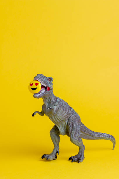 istock Dinosaur on a yellow background. Toy. Creative idea. Concept. 1267153759