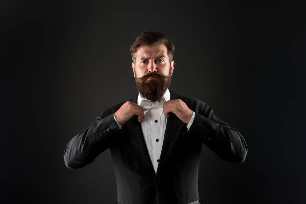 istock Bearded man with bow tie. Well dressed and scrupulously neat. Hipster formal suit tuxedo. Difference between vintage and classic. Official event dress code. Classic style. Menswear classic outfit 1267153974