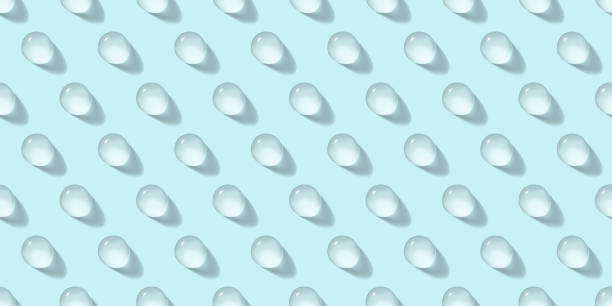 istock Water drops seamless vector pattern on pastel blue background. Beauty skin care cosmetics product realistic backdrop 1267155996