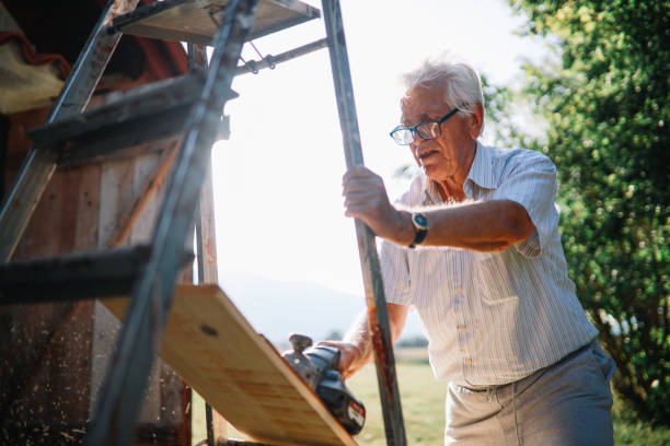 istock Senior man working on his weekend house 1267156212