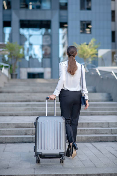 istock Tall brunette woman carrying her big suitcase 1267156684