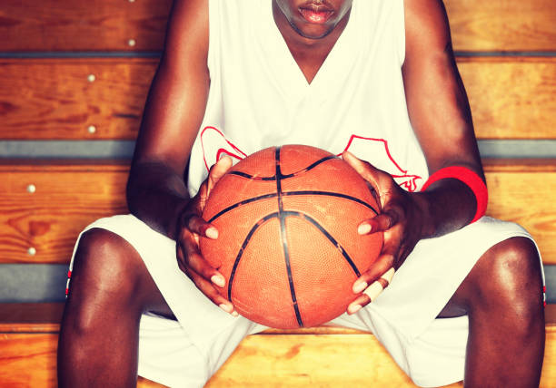 istock Basketball Player holding basketball 1267156763