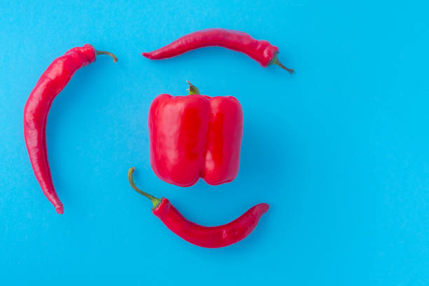 istock Three red hot chili peppers combined together. 1267158088