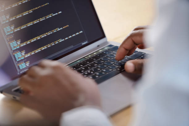 istock An office worker in a shirt is typing something on a modern laptop 1267159569