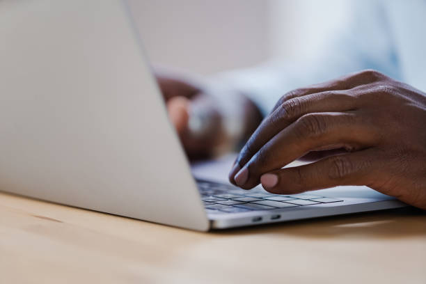 istock An office worker in a shirt is typing something on a modern laptop 1267159640