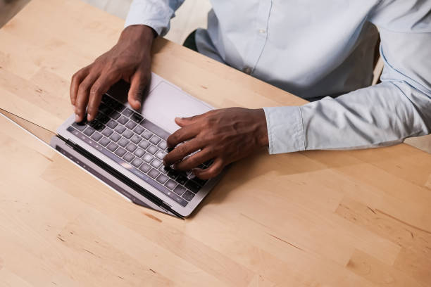 istock An office worker in a shirt is typing something on a modern laptop 1267159645