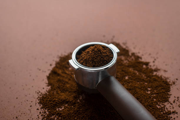 istock Portafilter coffee machine holder with ground beans 1267160913