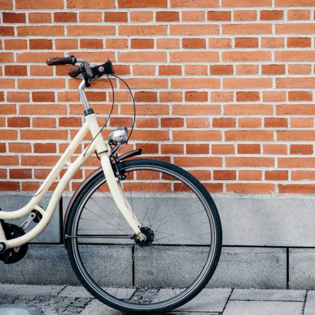 istock Vintage bicycle on the brick wall background 1267160963