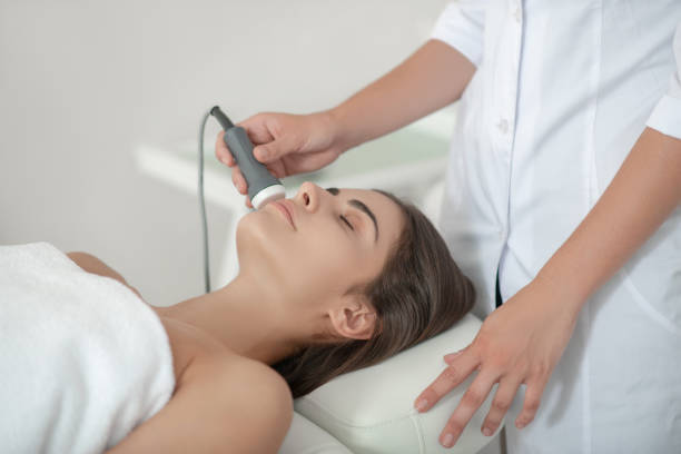 istock Cosmetologist working with a customer in a beauty salon 1267161402