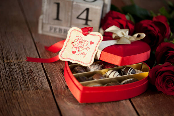 istock Valentine's Day Box of Chocolates and Red Roses 1267163898