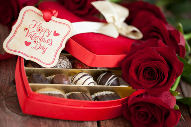 istock Valentine's Day Box of Chocolates and Red Roses 1267164318