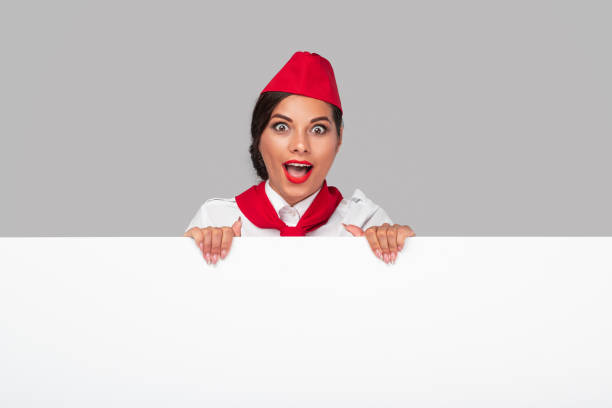 istock Surprised stewardess in vibrant uniform 1267165224