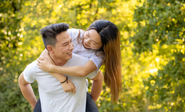istock young boyfriend piggybacking girlfriend at park 1267165236