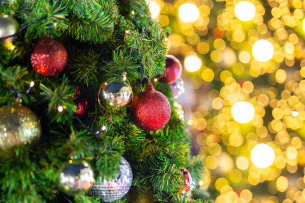 istock Beautiful Christmas tree with decor against blurred bokeh lights in background. 1267166172