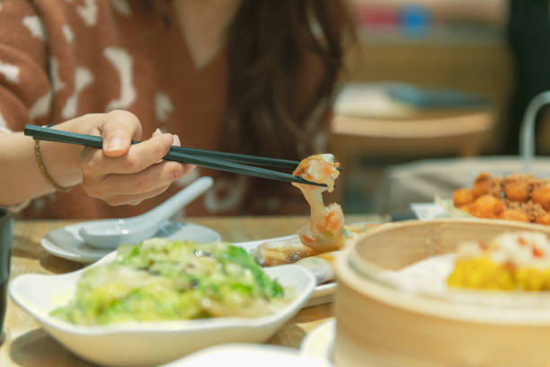 Woman eating in restaurant