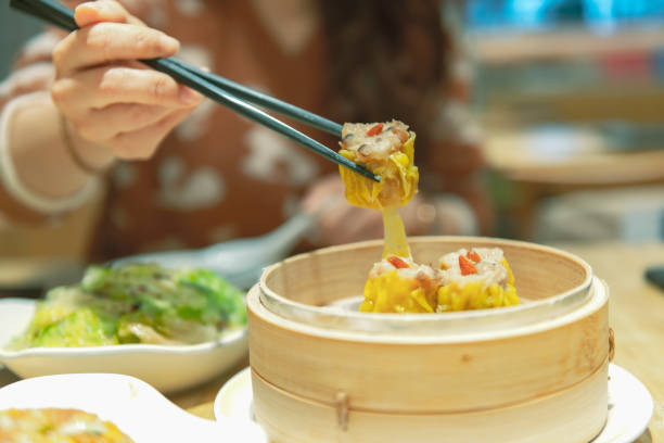 istock Woman eating in restaurant 1267166223