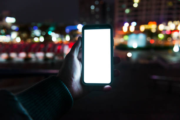 istock Woman hand using mobile phone in city 1267166753