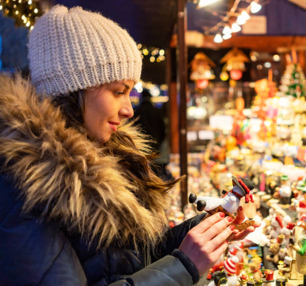 istock Choosing a gift at a Christmas Market stall 1267167007