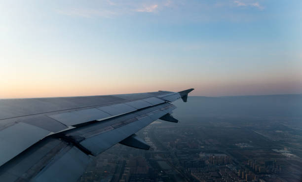 istock Beautiful sunset through the plane window 1267167801