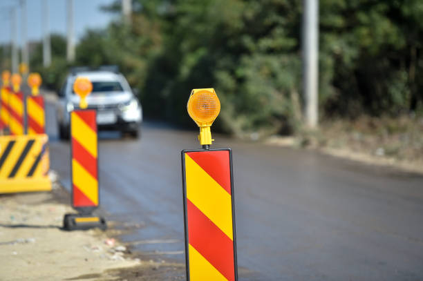 istock Yellow warning lights in a hazard zone during construction road works 1267168501