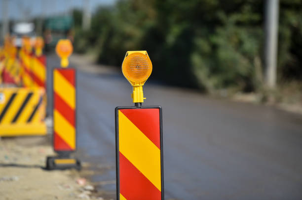 istock Yellow warning lights in a hazard zone during construction road works 1267168508