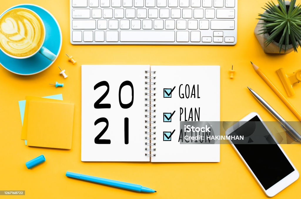 2021 new year goal,plan,action text on notepad with office accessories.Business management,Inspiration concepts 2021 new year goal,plan,action text on notepad with office accessories.Business management,Inspiration concepts ideas Aspirations Stock Photo