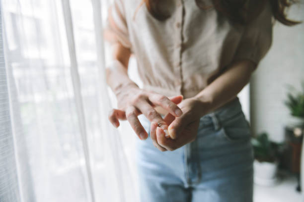 istock Woman massaging her arthritic hand and wrist 1267170474