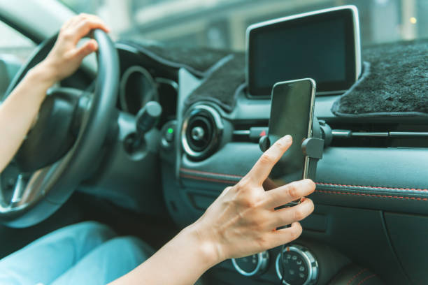 istock Woman using smartphone in the car 1267171146