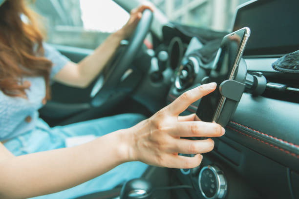 istock Woman using smartphone in the car 1267171159