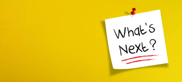 istock White note paper with what's next on yellow background 1267171301