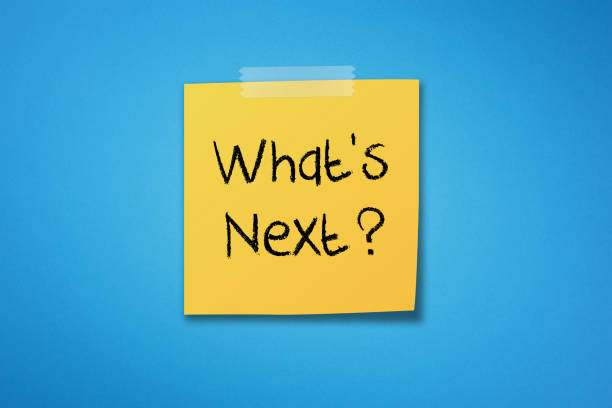 Yellow sticky note paper with what's next on blue background