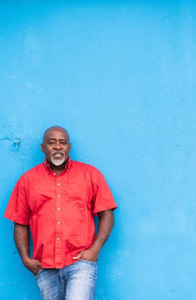 istock Mature afro man portrait on blue background 1267172829