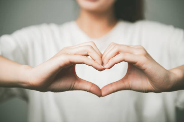 istock Girl hand in heart form love 1267173459