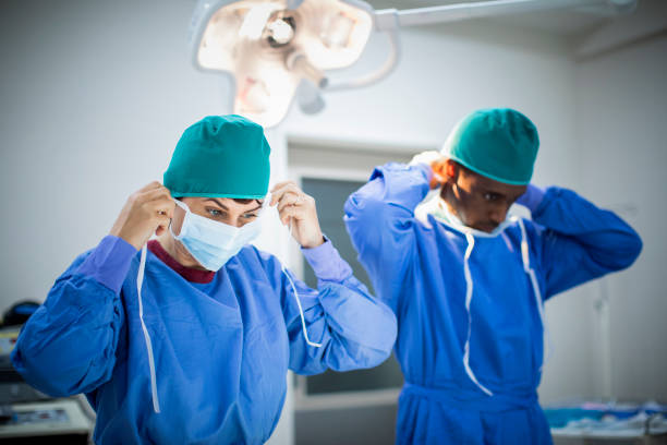 istock Two doctors prepping for an operation in an operating room 1267173659