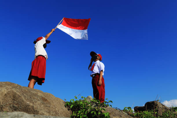 istock An elementary school children carrying an Indonesian flag 1267174329