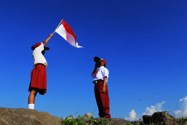 istock An elementary school children carrying an Indonesian flag 1267174485