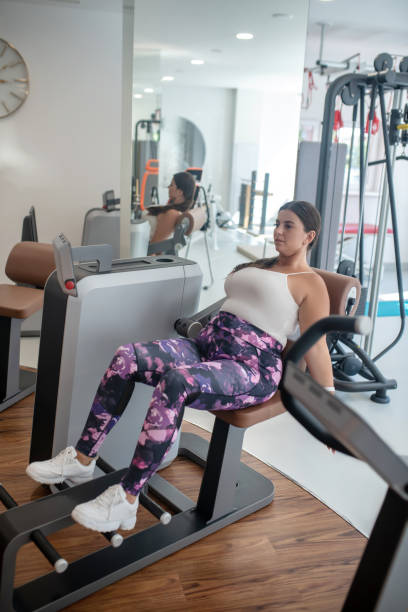 istock Woman doing exercises to improve her strength 1267174487