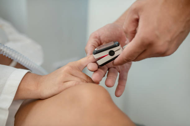 istock Doctor fitting a pulsometer to his patient 1267174519