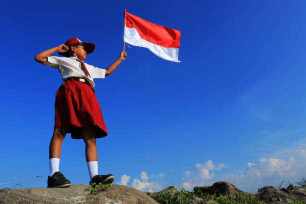 istock An elementary school children carrying an Indonesian flag 1267174602