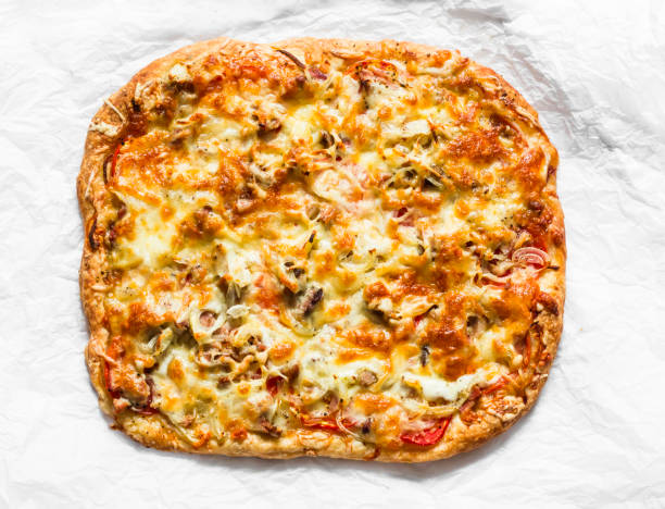 delicious tapas, snack, appetizer. canned tuna, tomatoes, mozzarella cheese pizza on a light background, top view - pizza tuna prepared fish cheese imagens e fotografias de stock