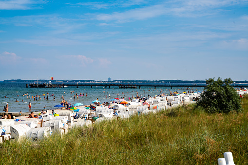 Scharbeutz, S-H / Germany - 9 August 2020: many people visit the Baltic Sea beaches of Lubeck Bay in northern Germany